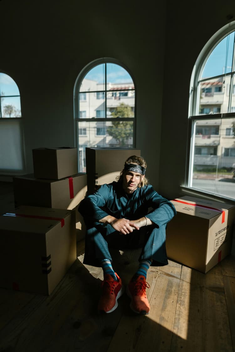 Man checking moving boxes before setup